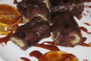 Budinca de clatite (cu sos de ciocolata si banane in sirop de portocale)