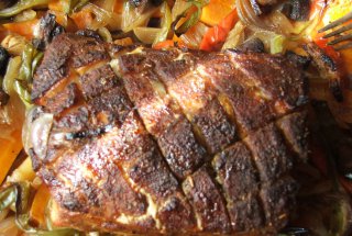 Cotlet de porc la tava pe pat de legume