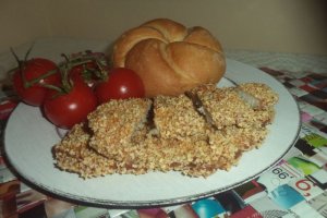 Snitele de porc in crusta din fulgi de mei