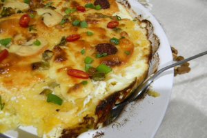 Mamaliguta gratinata cu branzeturi si iaurt