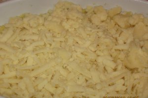 Mamaliguta  cu branza de burduf si oua la cuptor